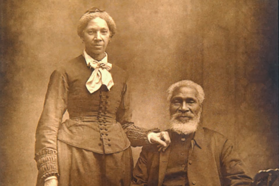 Henson posing with his wife, Nancy.